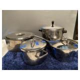 (Q)  Assortment of Potsand Pans  Cuisinart