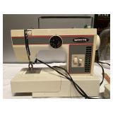 (W) White  Sewing Machine  has reverse and does