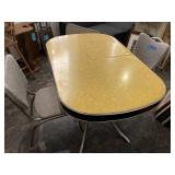 Vintage table (yellow and black) with tow chairs.