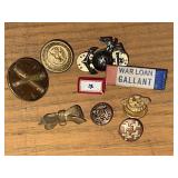 Collection of military buttons and pins.