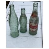 Vintage  Coke bottles and Dr Pepper bottle