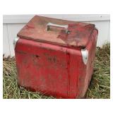 Vintage red metal cooler.