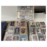 R9) Baseball and football cards- three binders.