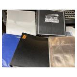 R9) Large selection of card sleeves and binders.