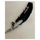 R9) Feather with Edmore on it.