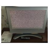FL) Sharp 26in flat screen TV with remote and book