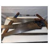 RR1) Vintage bow saw and three hand saws.