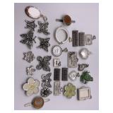 R4) Many small trinkets mostly butterfly pendants
