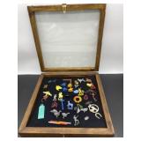 (R10). Display Case with little assortment of