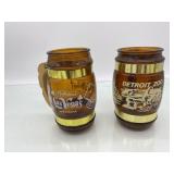 (R12)  Two Mugs Amber Color  5 inches tall  one