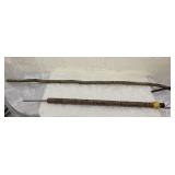 FL) Hand carved walking sticks. One has an