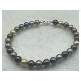 R2) Sterling silver necklace with neutral tones