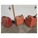 Plastic gas jugs, two 6 gallons, one 5 gallon
