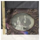 Old family photo, ornate wood frame