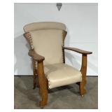 Leather upholstered wood carved chair. Pressed