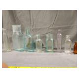 Antique apothecary bottles and one embossed cpb
