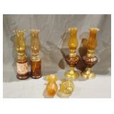 Two matching sets of Amber oil table lamps two