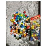 Bag of 60 marble king marbles along side mixed