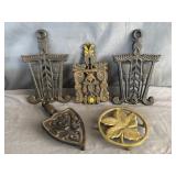 (4) Cast Iron Trivets & (1) Brass Trivet