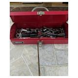 Toolbox full of ratchets and sockets