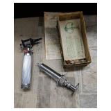 Otoscope and syringe