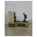 Cast iron piggy bank
Soccer player kicks change