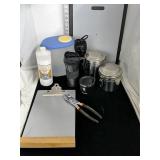 Cutting boards, drinking cups, canisters, pliers,