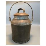 Approximately 10 inches tall galvanized Can with