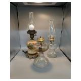 Two oil lamps and one electric lamp