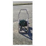 Hose reel with hose, sprinker and sprayer