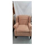 Salmon color chair 
By the fabric place 
Grand