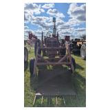 Antique Farmall tractor with loader