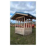 Covered hay feeder