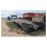 Tri axle flatbed trailer with dove tail and ramps