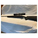 Savage Axis 223 bolt action w/ stainless steele black stock acc trigger w/ scope