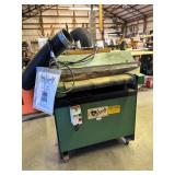 Sander with paperwork 