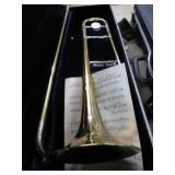 CONN TROMBONE W/ 2 MOUTH PIECES -- HAS DENTS