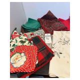 Assorted Christmas Table Cloths, Placemats, Napkins, and Pot Holders