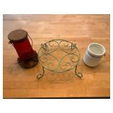Assorted Garden Decor Lot Featuring Plant Stand, Bird Feeder, and Glass Jar