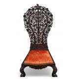 Anglo-Pacific Heavily-Carved Exotic Slipper Chair