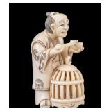 Carved Figure of Man with Bird Cage