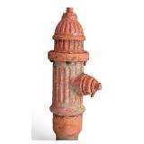 Red Cast Iron Fire Hydrant with Rusted Base