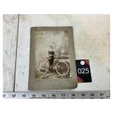 Antique child and bicycle photo