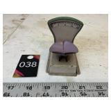 Small pressed tin scale