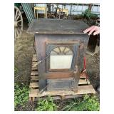 Coal burning forced air stove