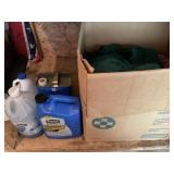 Box of rags and partial bottles of garage liquids