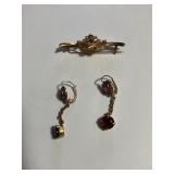 Pair of earring and a brooch