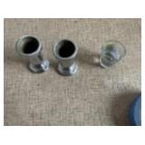 Shot glass and metal candle stick holders