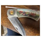 Large knife with tractor on it