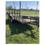 Wooden deck tandem axle utility trailer